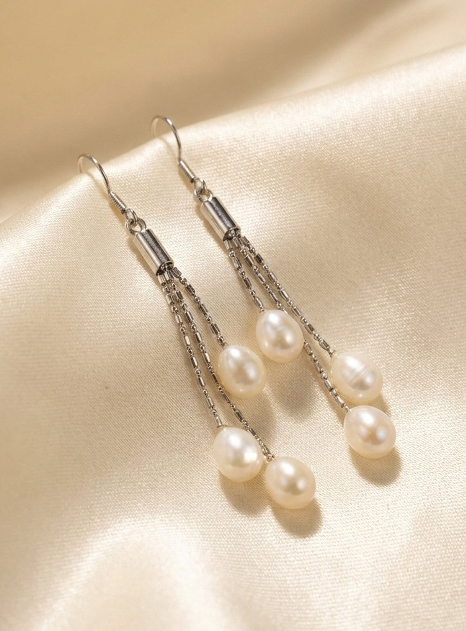 Elegant Triple-Strand Pearl Cascade Drop Earrings – Silver Tassel Design
