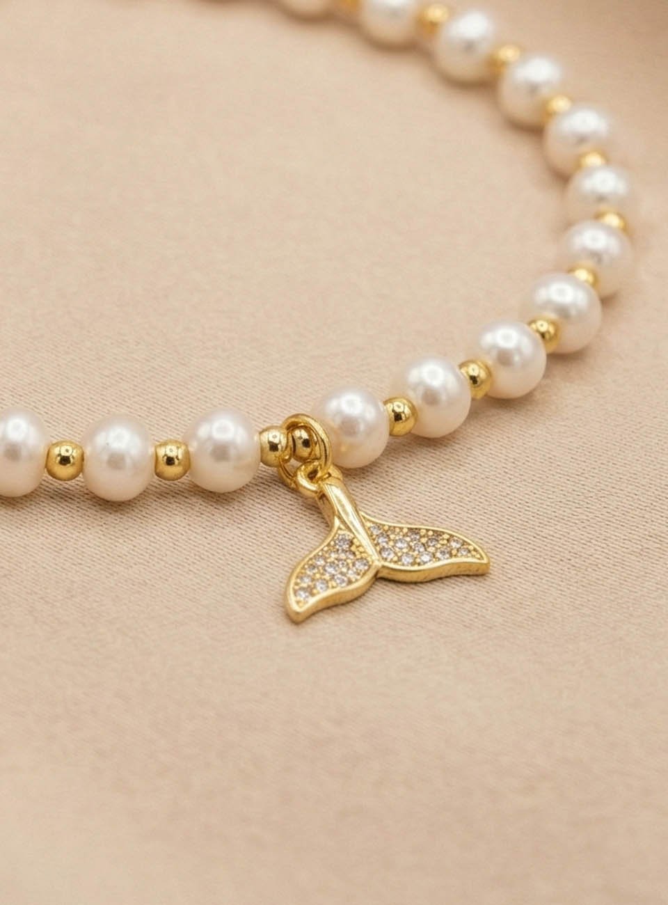 Mermaid’s Grace – Luminous Pearl & Whale Tail Charm Bracelet