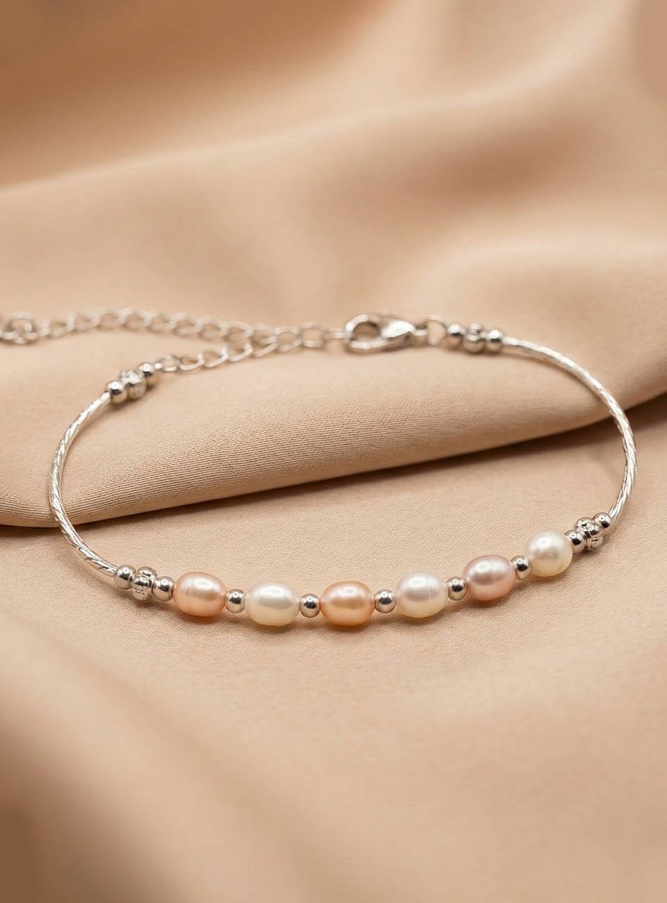 Elegant Multi-Tone Rice Pearl Bracelet – Shimmering Trio of White, Pink & Peach