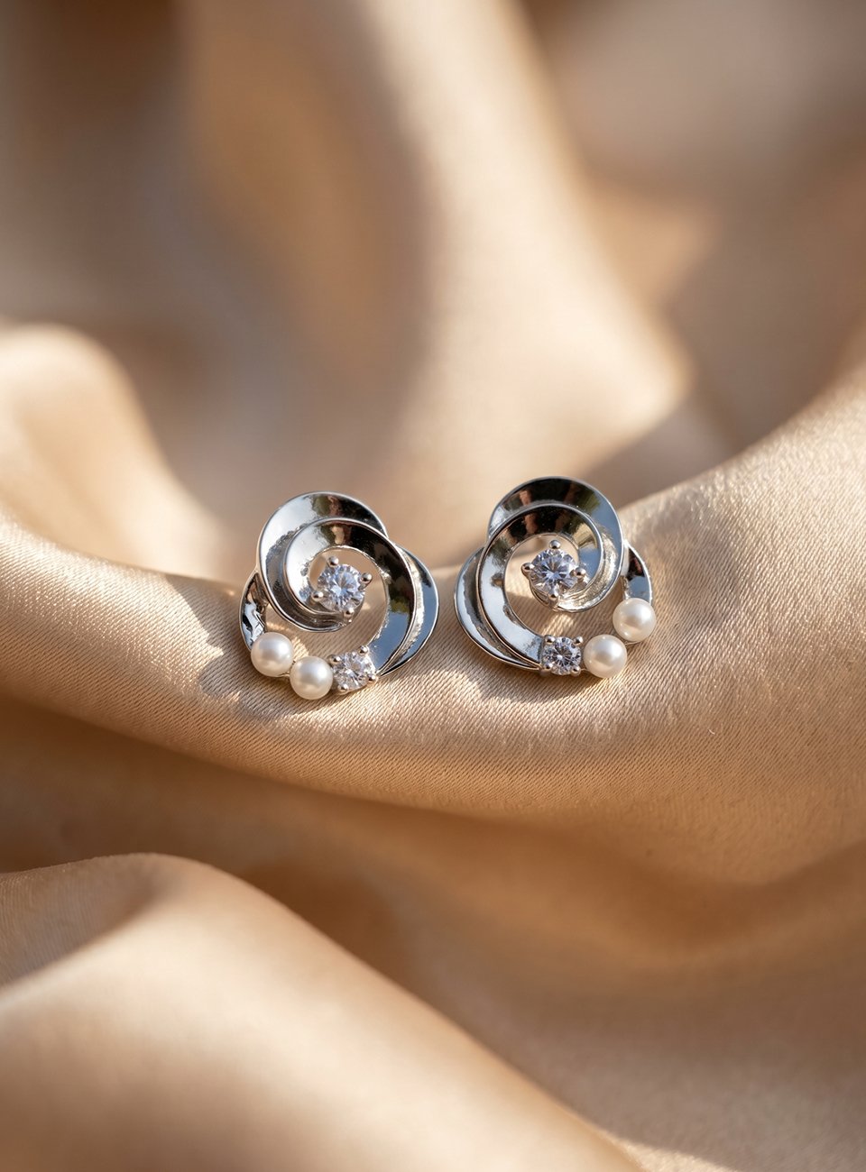 Elegant Mother of Pearl Swirl Stud Earrings with Cubic Zirconia – Silver Tone